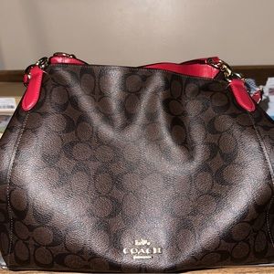 Authentic Coach leather shoulder bag with red leather straps